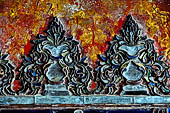 Glass mosaics depicting Buddhist stories lining walls around stupa in Shwe Yaunghwe Kyaung. Buddhist monastery, near Inle Lake. Myanmar. 